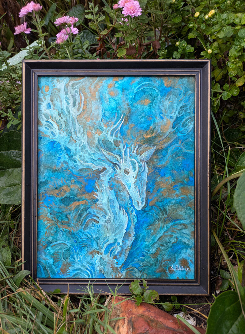 Photo of a painting of a deer in a frame. it is surrounded by plants outside.
