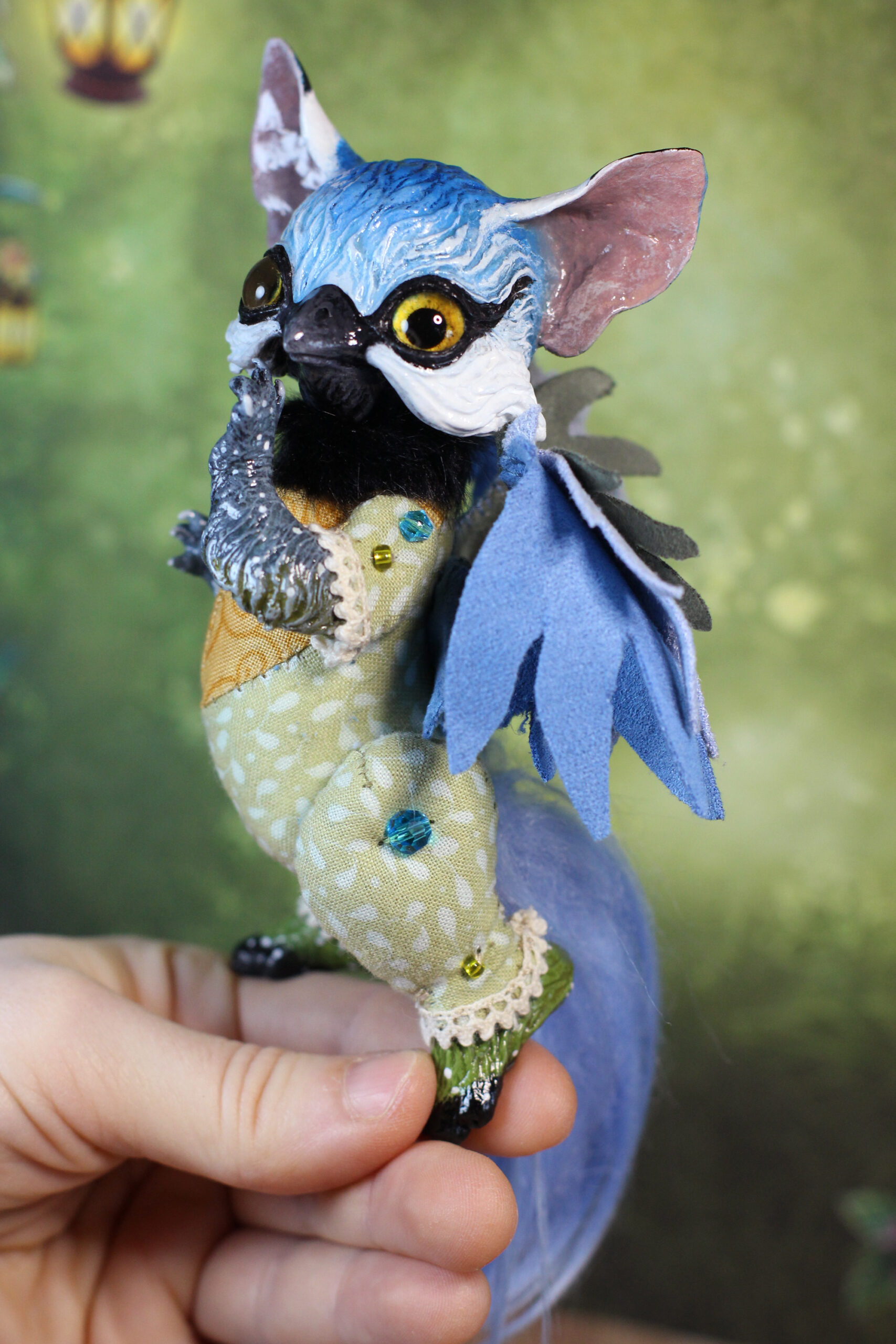 original art doll of a bluetit mixed with a cat standing on its hind paws made by Svetlana Polupanova