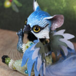 original art doll of a bluetit mixed with a cat standing on its hind paws made by Svetlana Polupanova