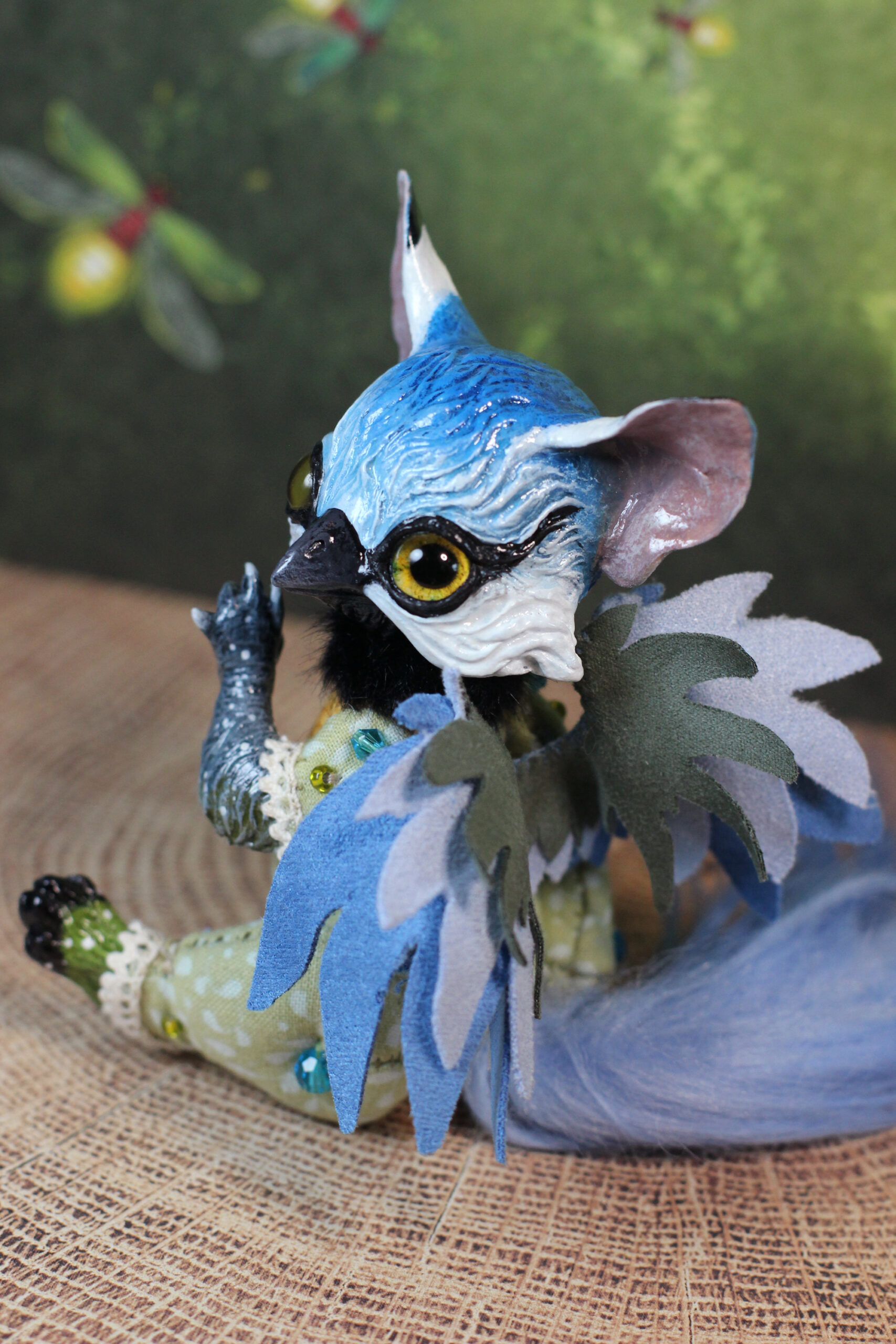 original art doll of a bluetit mixed with a cat standing on its hind paws made by Svetlana Polupanova