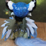 original art doll of a bluetit mixed with a cat standing on its hind paws made by Svetlana Polupanova