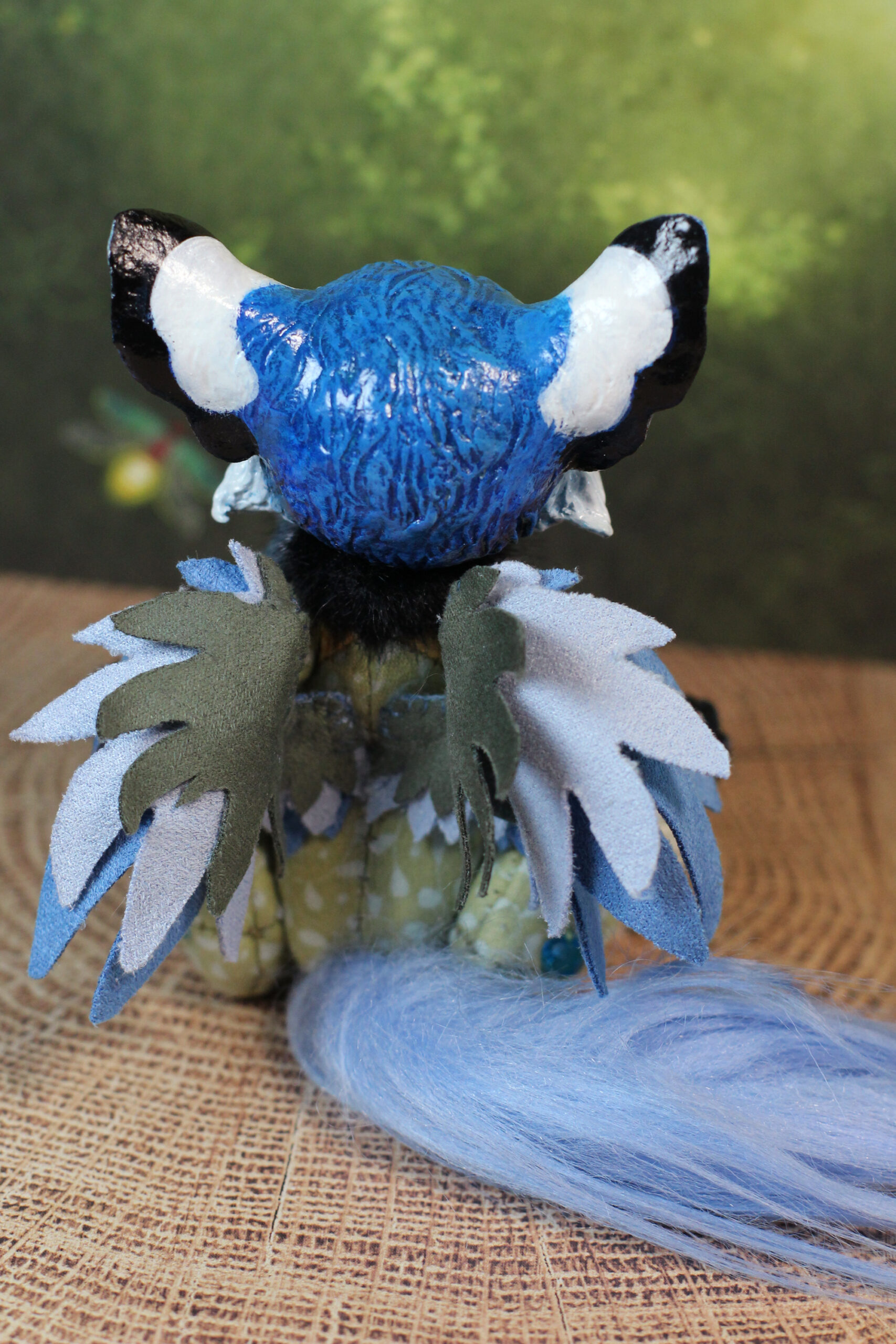 original art doll of a bluetit mixed with a cat standing on its hind paws made by Svetlana Polupanova
