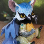 original art doll of a bluetit mixed with a cat standing on its hind paws made by Svetlana Polupanova