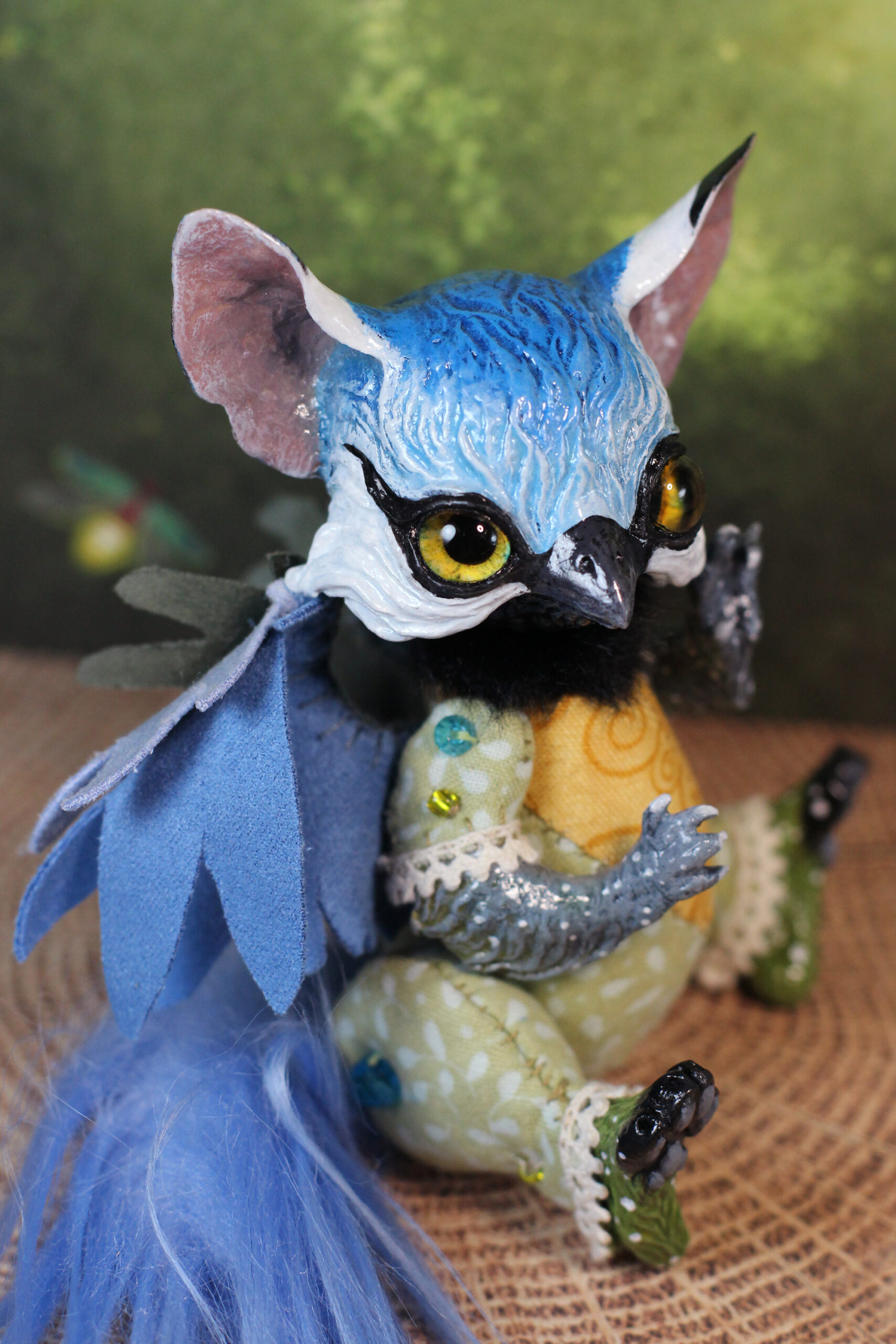 original art doll of a bluetit mixed with a cat standing on its hind paws made by Svetlana Polupanova