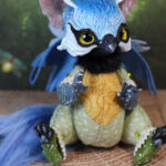 original art doll of a bluetit mixed with a cat sitting made by Svetlana Polupanova