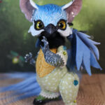 original art doll of a bluetit mixed with a cat standing on its hind paws made by Svetlana Polupanova