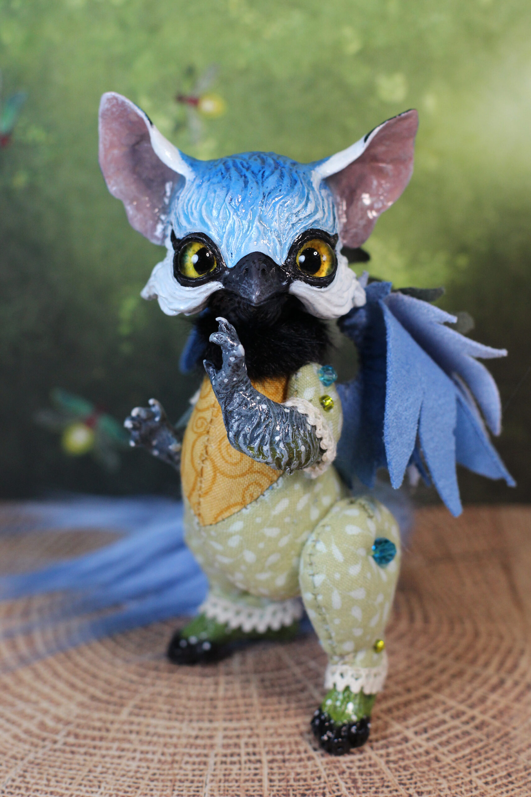 original art doll of a bluetit mixed with a cat standing on its hind paws made by Svetlana Polupanova
