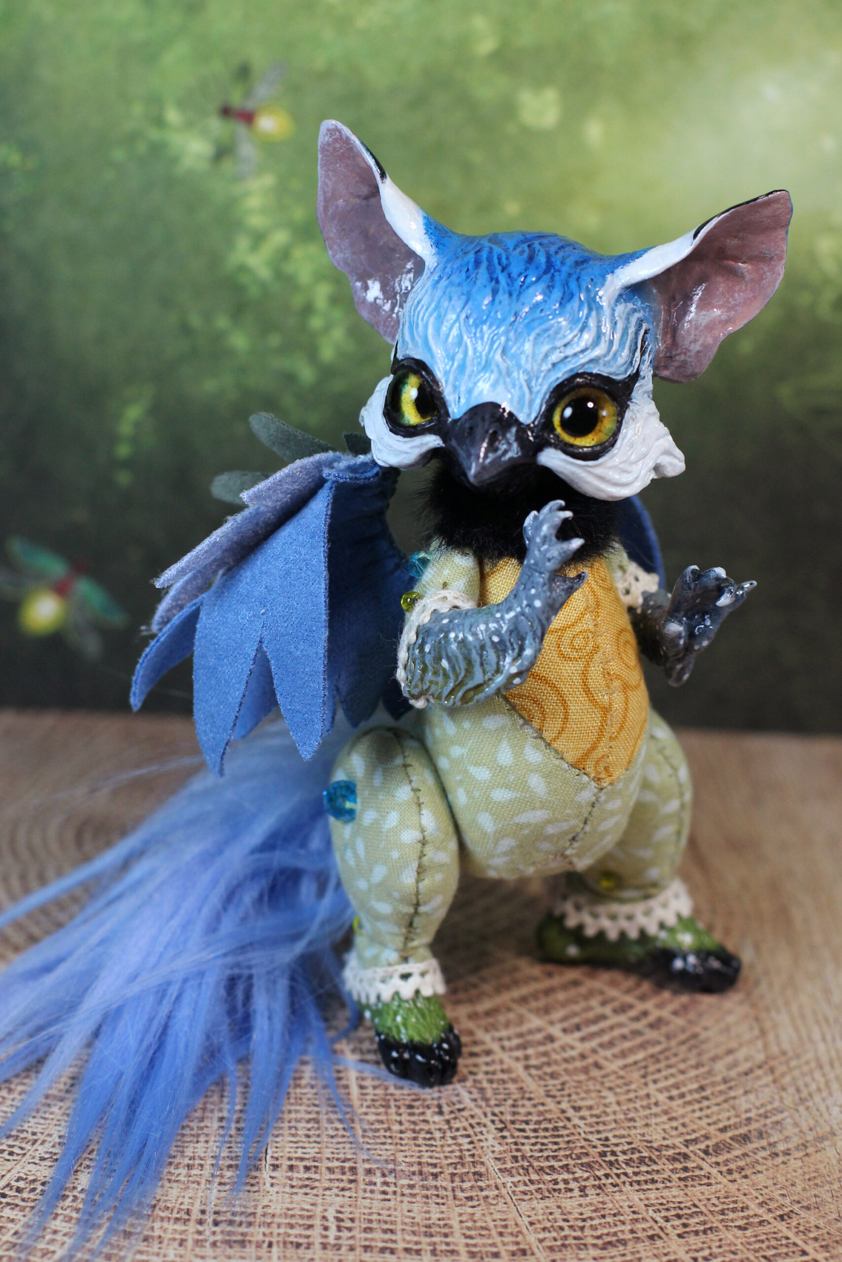 original art doll of a bluetit mixed with a cat standing on its hind paws made by Svetlana Polupanova