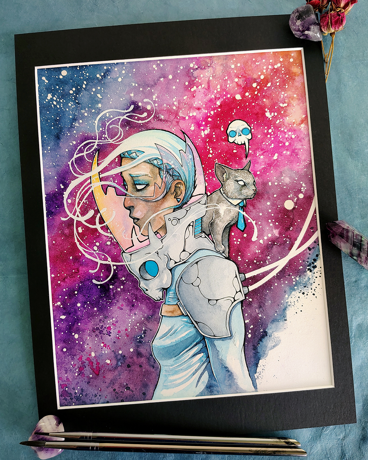 Photo of This Cosmic Business watercolor painting set in black mat board.