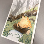 Side view of original artwork, photographed on neutral background with warm light