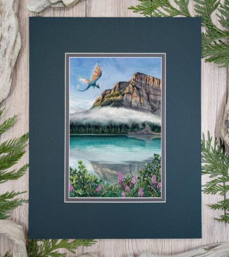 Photo of an artwork of a dragon flying over a glacial mountain lake with a cloud, plants in the foreground including fireweed flowers.