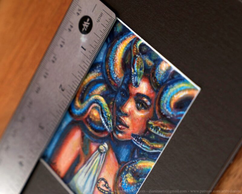 A portrait of Medusa with colorful snakes. Miniature painting. Ruler for scale