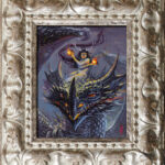 A framed picture of a fire fairy riding a dragon