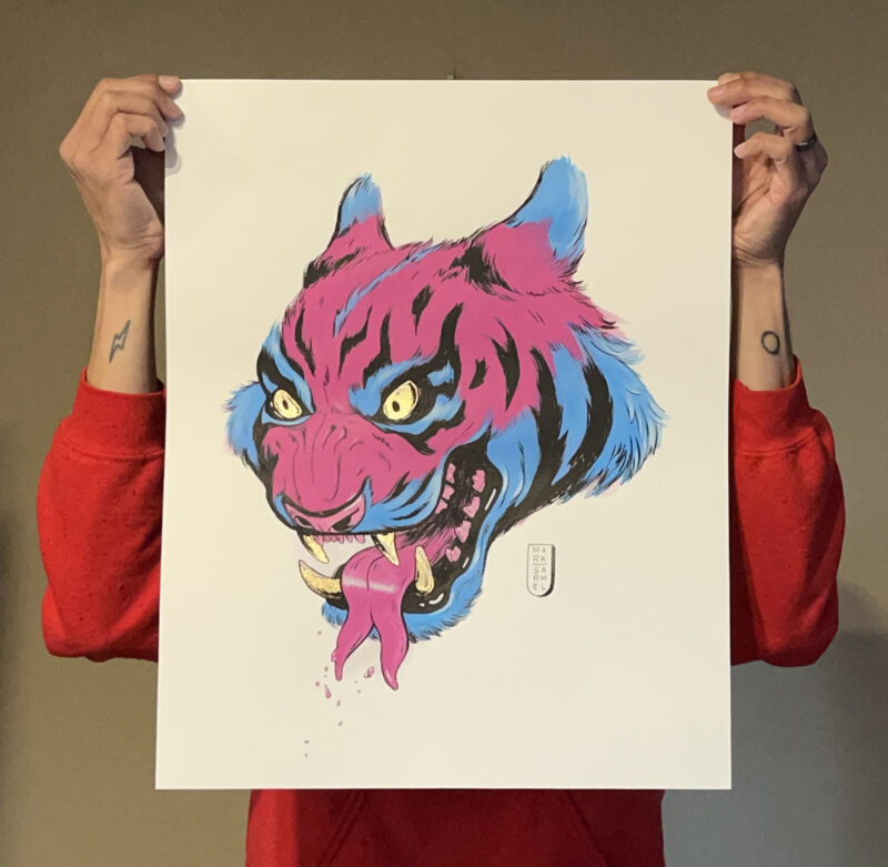 An image of the artist holding the acrylic painting on watercolor paper of a