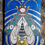 An acryla gouache painting of a lightning bug with gold leaf emanating from its glowing end. The lightning bug is on a blue background and has images of a moonflower plant drawn over its wings and body.