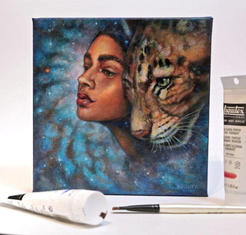 Photo of the painting with some materials next to it