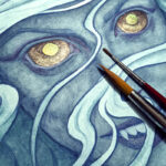 Close-up shot of Siren's Hunger, showing metallic sheen on the eyes, with paintbrushes laid on top