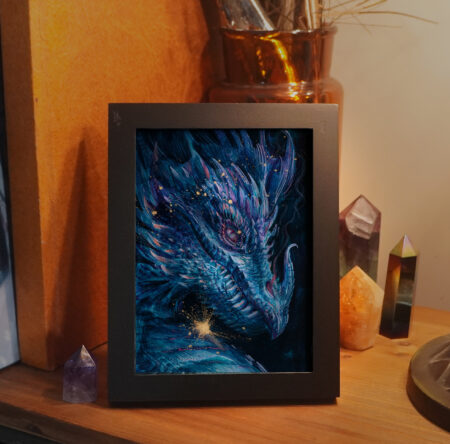 A framed painting illustrating a portrait of a golden cyan dragon