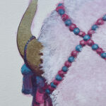 A detail image of a painting of a white bison. This detail image is of the bison's horn. It is decorated with pom poms and random ephemera.