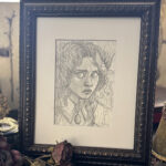 Closer crop studio shot of framed and matted drawing