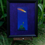 front view of a framed oil painting of a green gummie candy brontosaurus standing on a grassy hill at night staring up into a deep blue sky at a falling star on a purple background photographed in a garden
