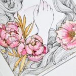 Close-up of a drawing. It shows the metallic outline I painted on the peonies. It shows the drawing at an angle so it can reflect the light.