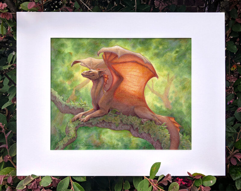 "Basking Warmth" with a white mat, against a leafy backdrop
