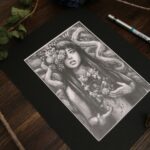 Graphite drawing of a female representing figure with marigolds coming out of one of her eyes. Long dark hair. Chest open, edges look like bark. A marigold comes out of the space. Tree branches at her back.