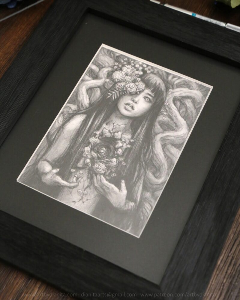 Graphite drawing of a female representing figure with marigolds coming out of one of her eyes. Long dark hair. Chest open, edges look like bark. A marigold comes out of the space. Tree branches at her back.