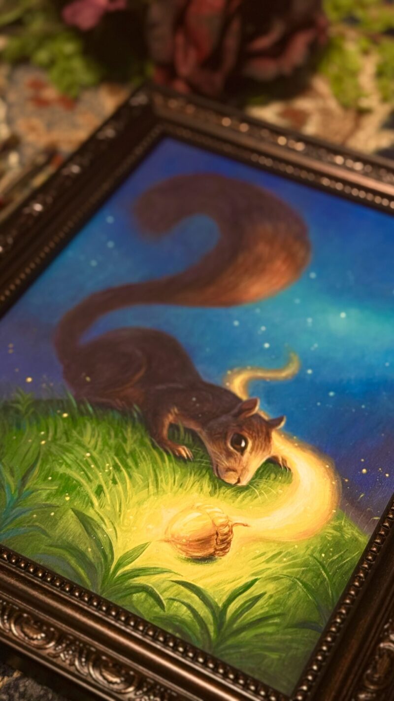 Tilted angle closeup of framed squirrel painting