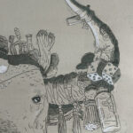 Detail shot of Mak the Yak's left horn that is decorated with pom poms and other various ephemera.