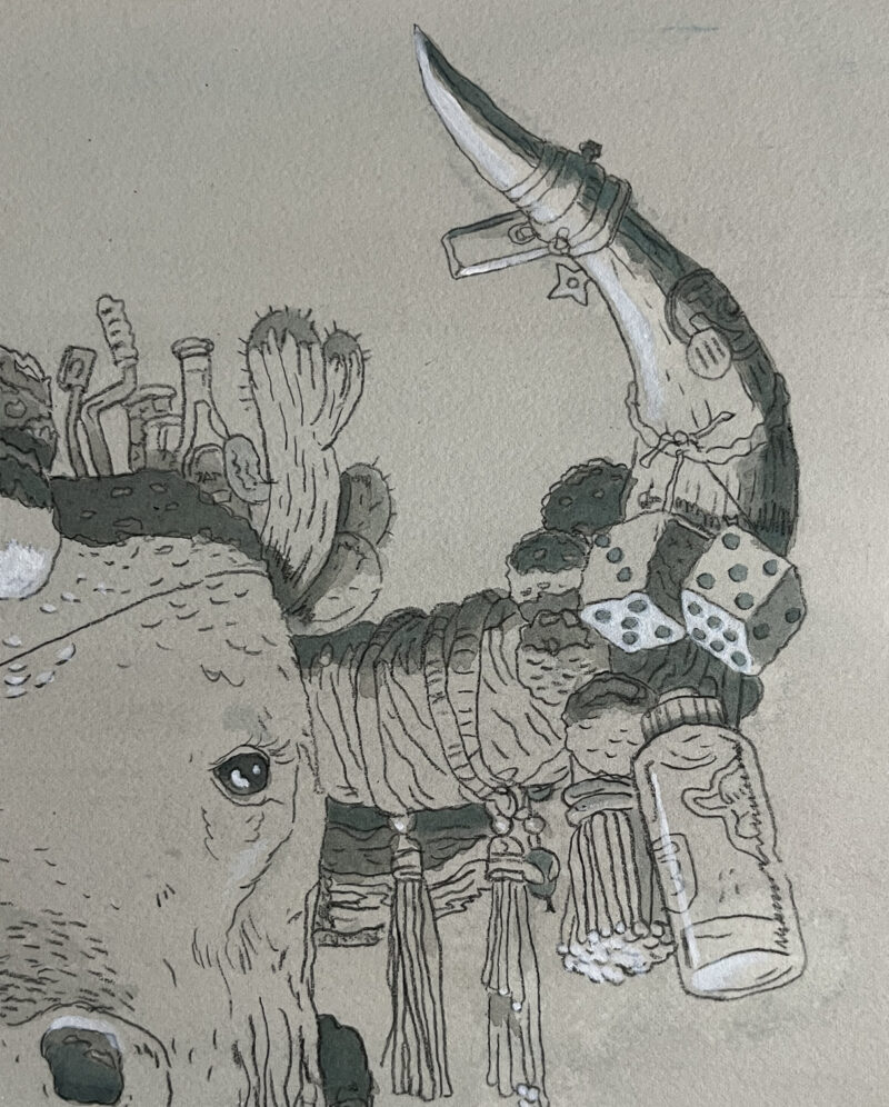 Detail shot of Mak the Yak's left horn that is decorated with pom poms and other various ephemera.