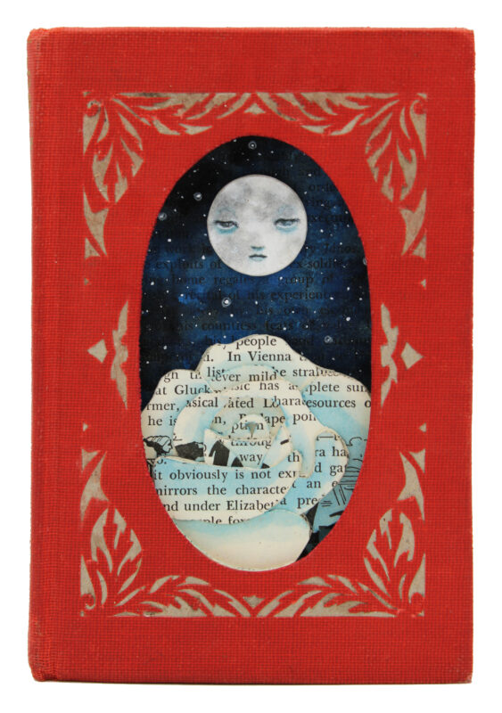 hand cut altered book with moon and rose