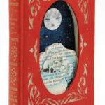 hand cut altered book with moon and rose