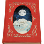 hand cut altered book with moon and rose