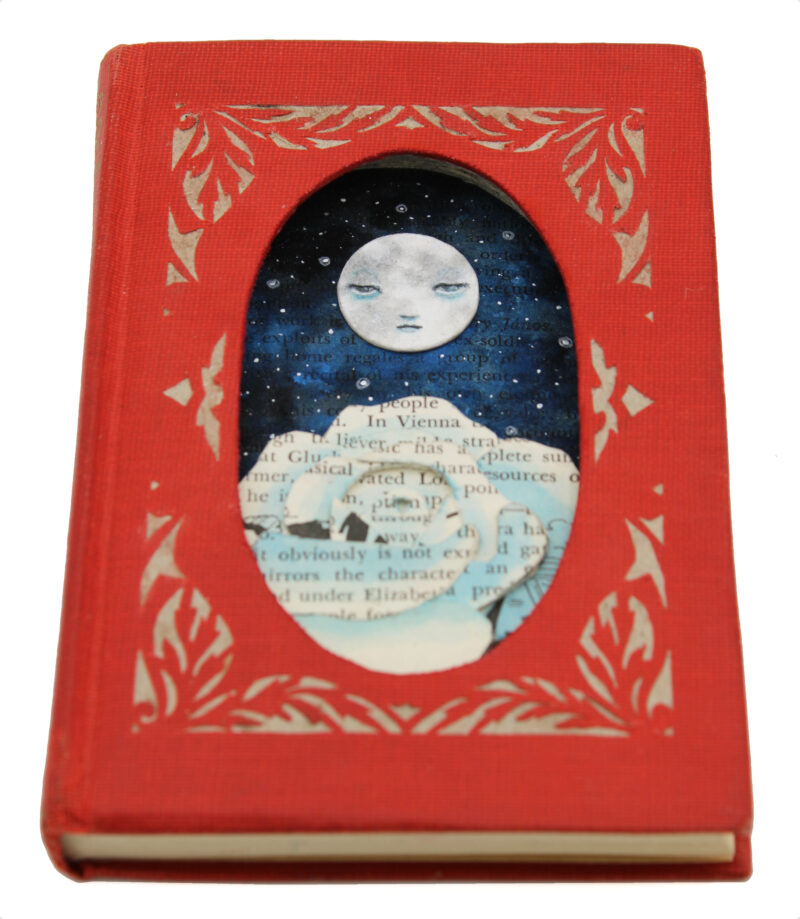 hand cut altered book with moon and rose