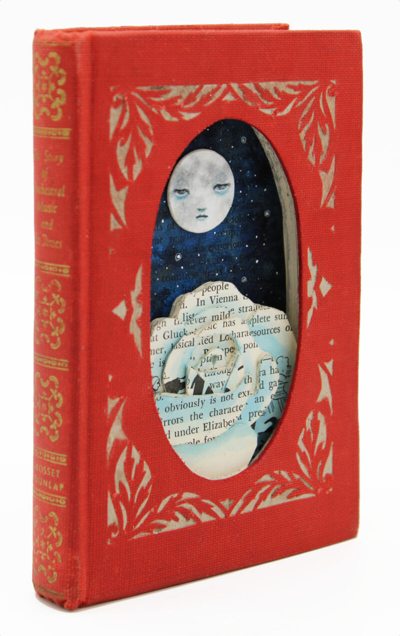 hand cut altered book with moon and rose