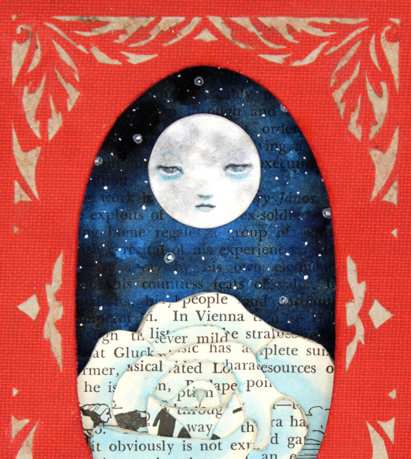 hand cut altered book with moon and rose